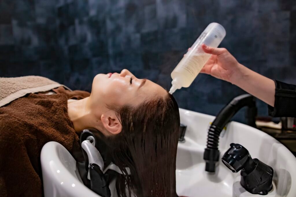 Woman pre wash in hair salon