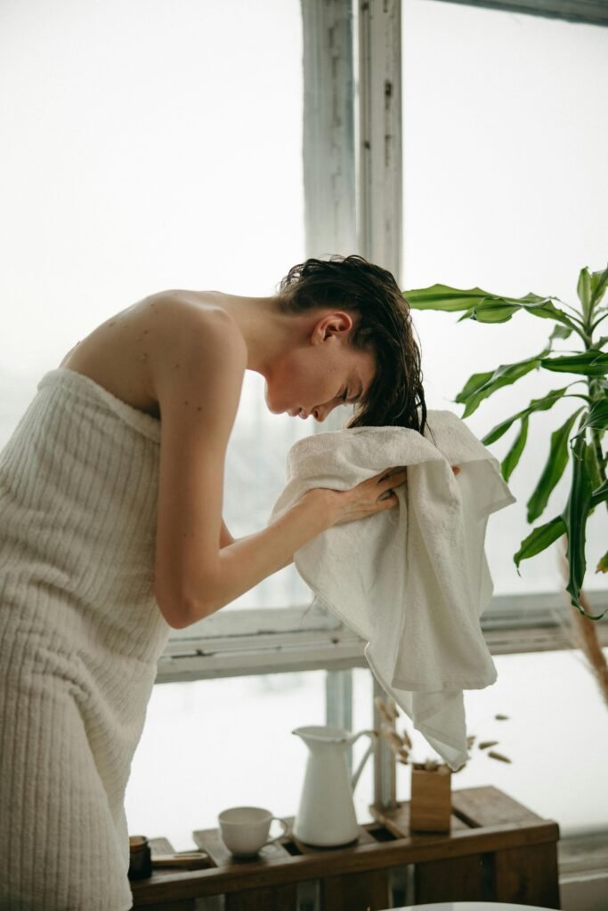 Woman applying pre wash to her hair